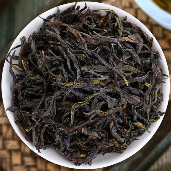 Loose dark dried tea leaves for Duck Shit Fragrant Dan Cong Oolong Tea in teapots or mugs