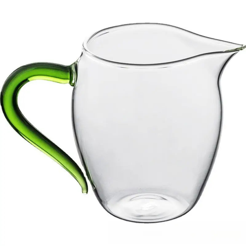 Eagle Beak tea pitcher made of high-borosilicate handblown glass with green handle