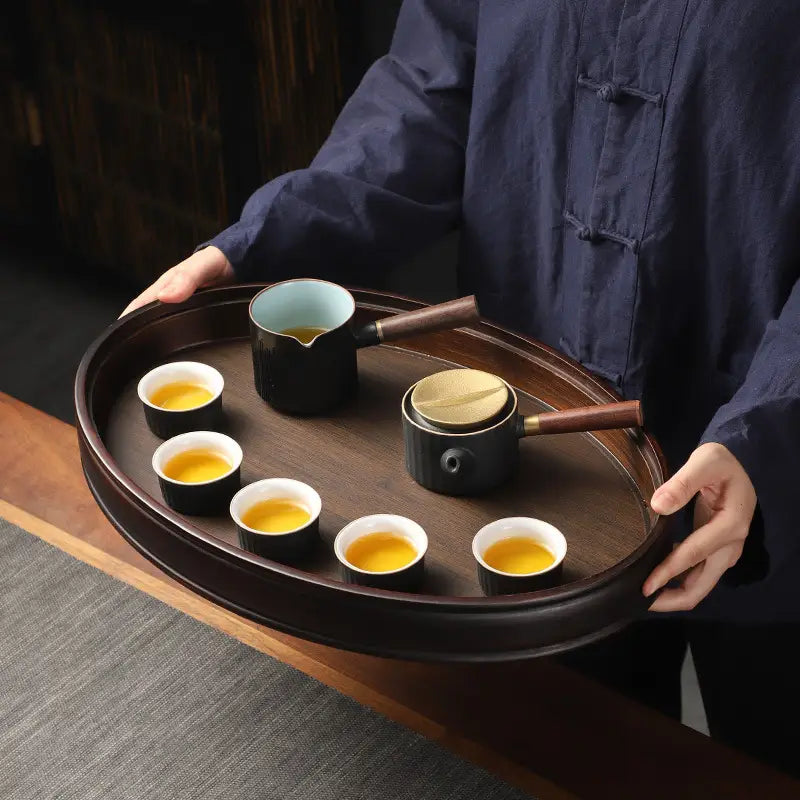 Tea set on a bamboo gongfu tray made of oval bamboo for elegant tea ceremonies