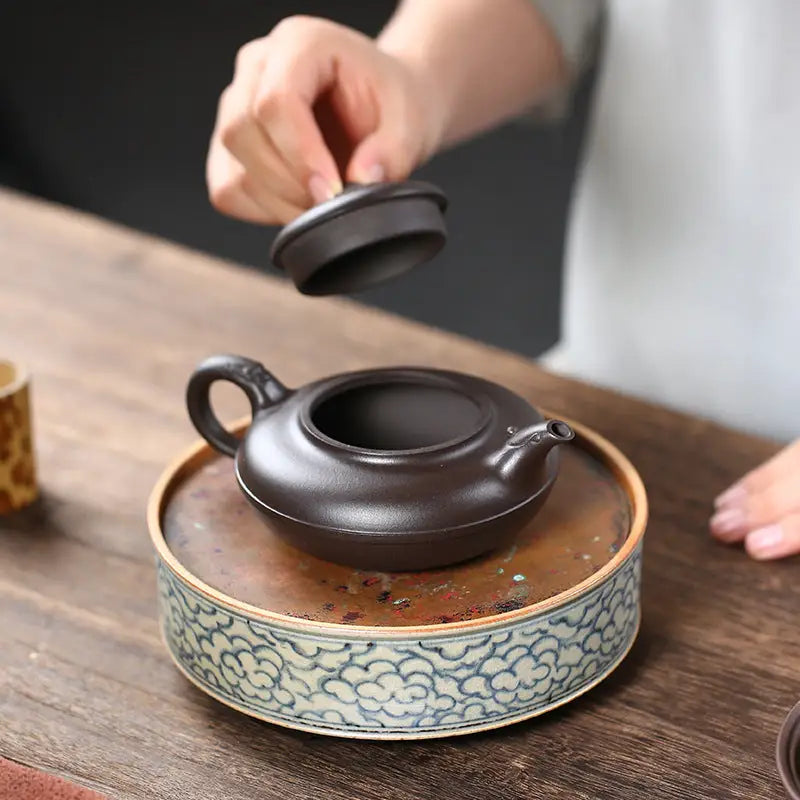 Dark brown Yixing Zisha teapot with lid from the Eclipse collection for authentic tea brewing