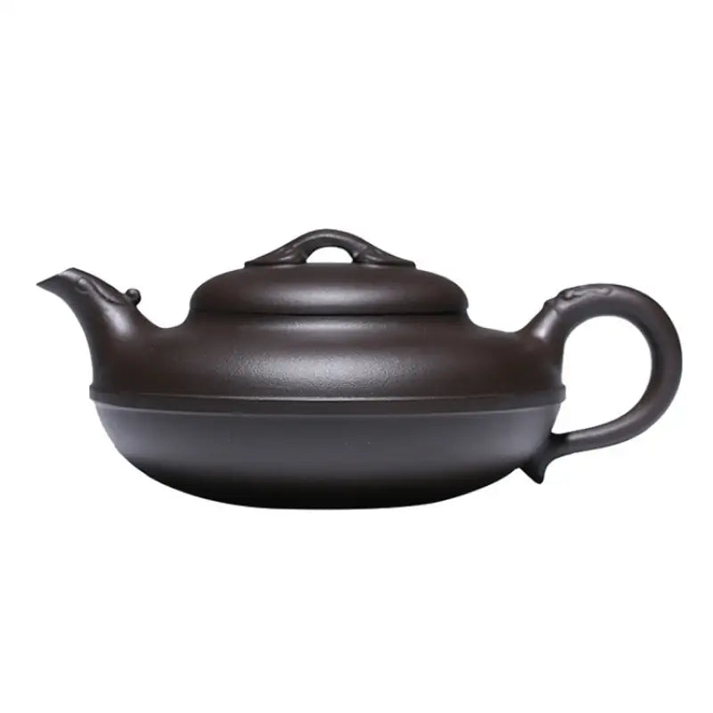 Dark brown Yixing Zisha teapot from the Eclipse collection showcasing craftsmanship
