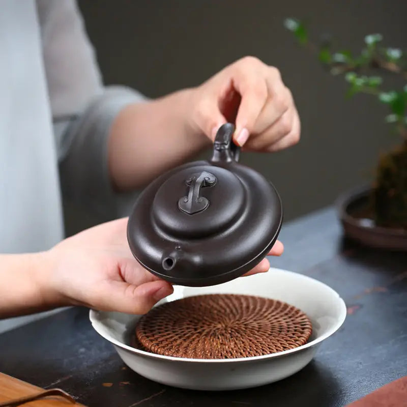 Dark brown Yixing Zisha teapot named Eclipse, traditional Yixing teapot craftsmanship