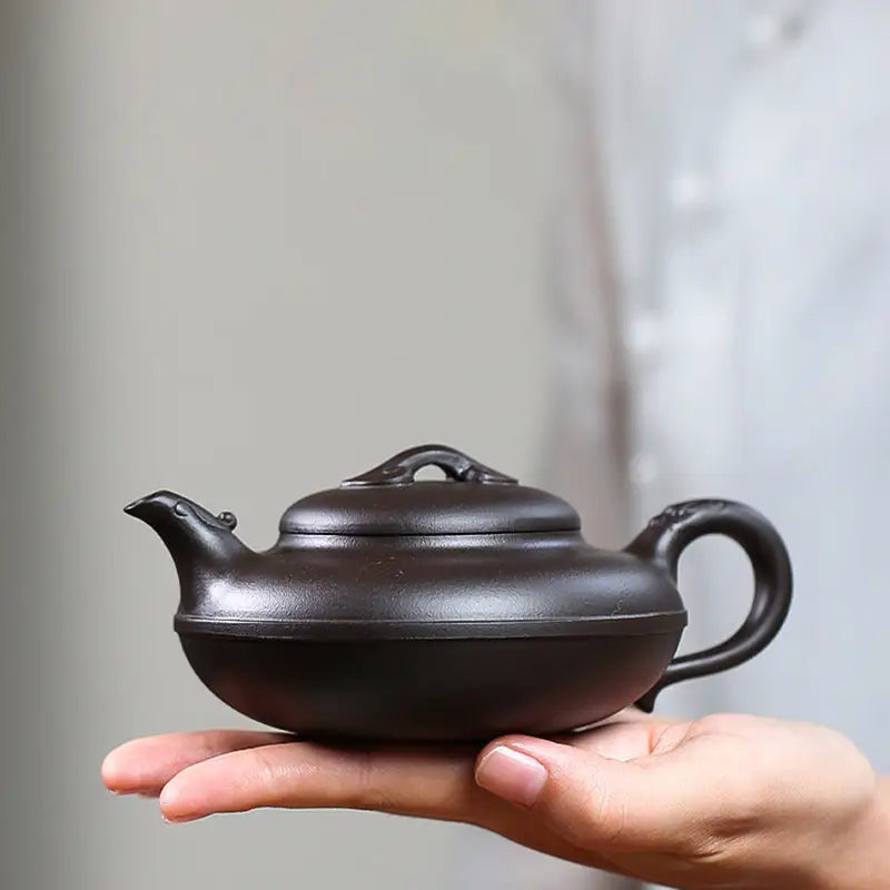 Dark brown Yixing Zisha teapot from the Eclipse collection showing traditional craftsmanship