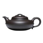 Dark brown Yixing Zisha teapot from the Eclipse collection showcasing craftsmanship