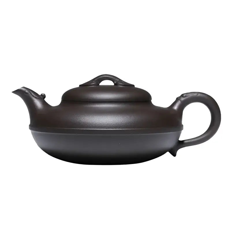 Dark brown Yixing Zisha teapot from the Eclipse collection showcasing craftsmanship