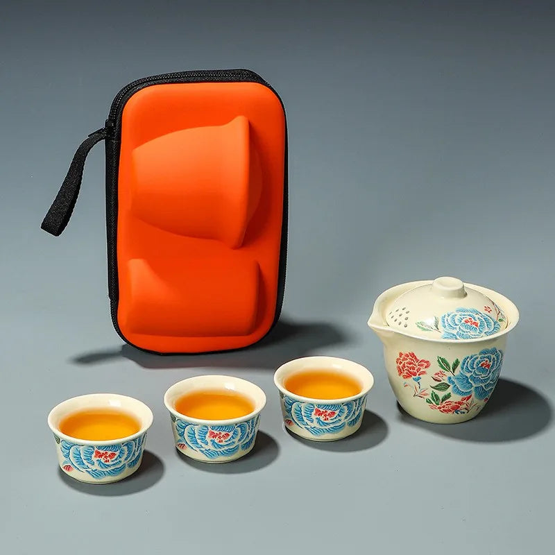 Embroidered peony porcelain travel tea set with filter pot, three cups and orange case – photo 1