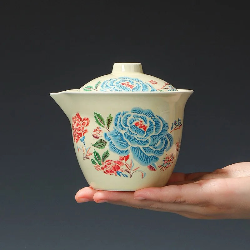 Embroidered peony porcelain travel tea set with filter pot, three cups and orange case – photo 4