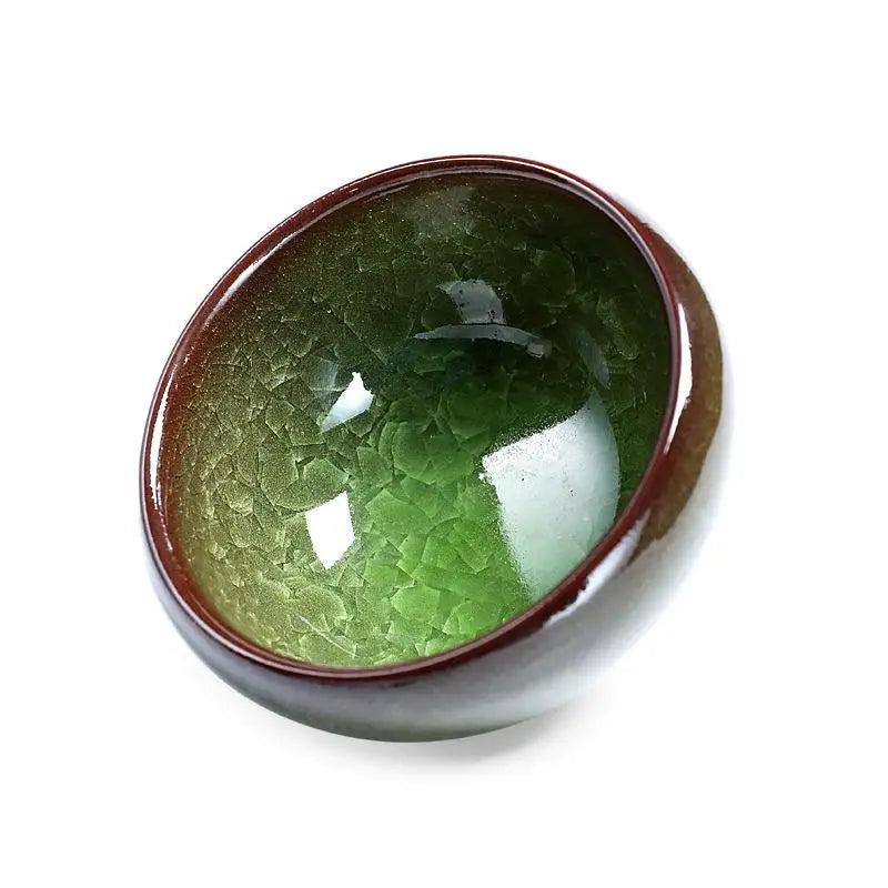 Green and brown glazed ceramic bowl from Emerald Jian Zhan with crystalline green glaze
