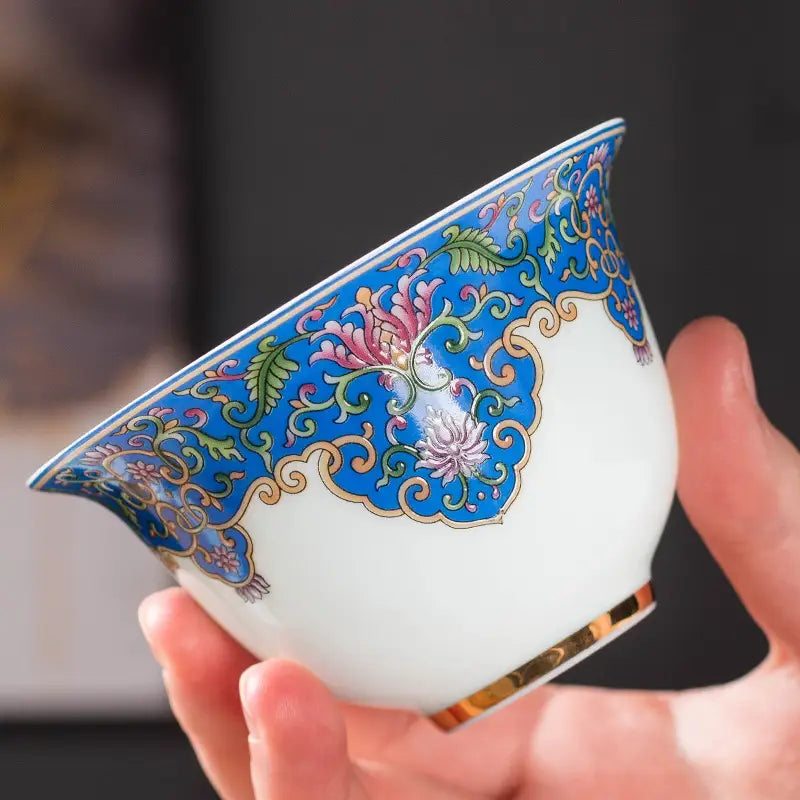 Ornate blue and white enameled porcelain teacup showcasing Jingdezhen enamel art for Gongfu tea