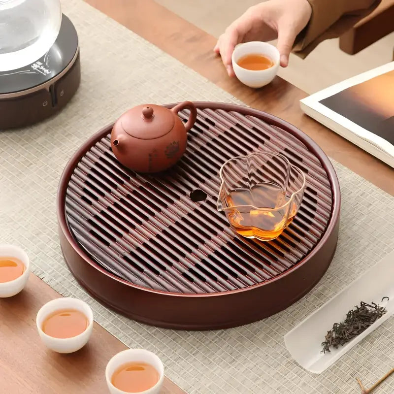 Flow Circle round bamboo tea tray with slatted design for elegant bamboo tea serving
