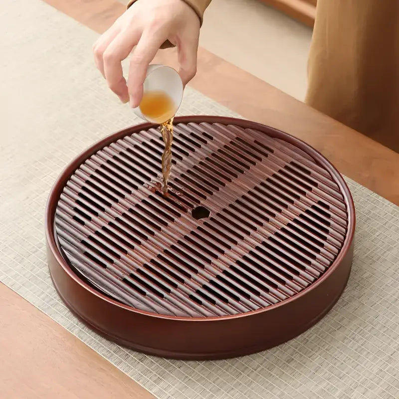 Flow Circle round bamboo tea tray with slatted design for elegant tea service