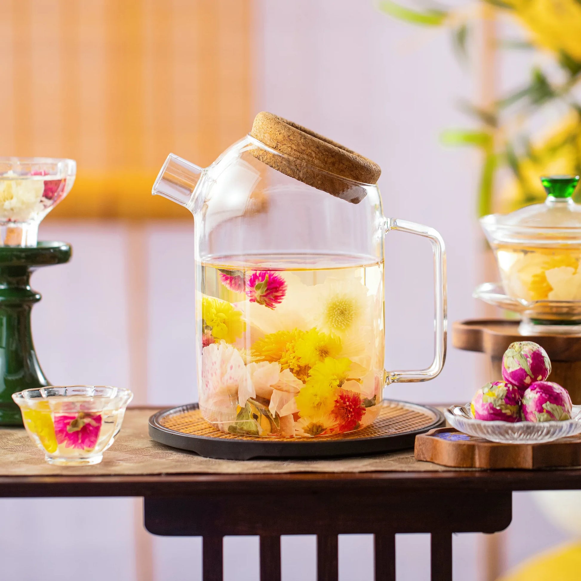 Yellow flowering tea bloom in a glass vessel