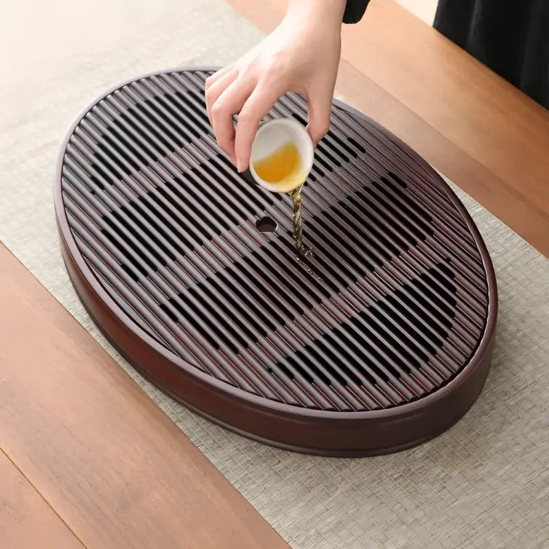 Oval wooden tea tray from Flowing Zen Bamboo Tea Tray collection for Gongfu tea brewing