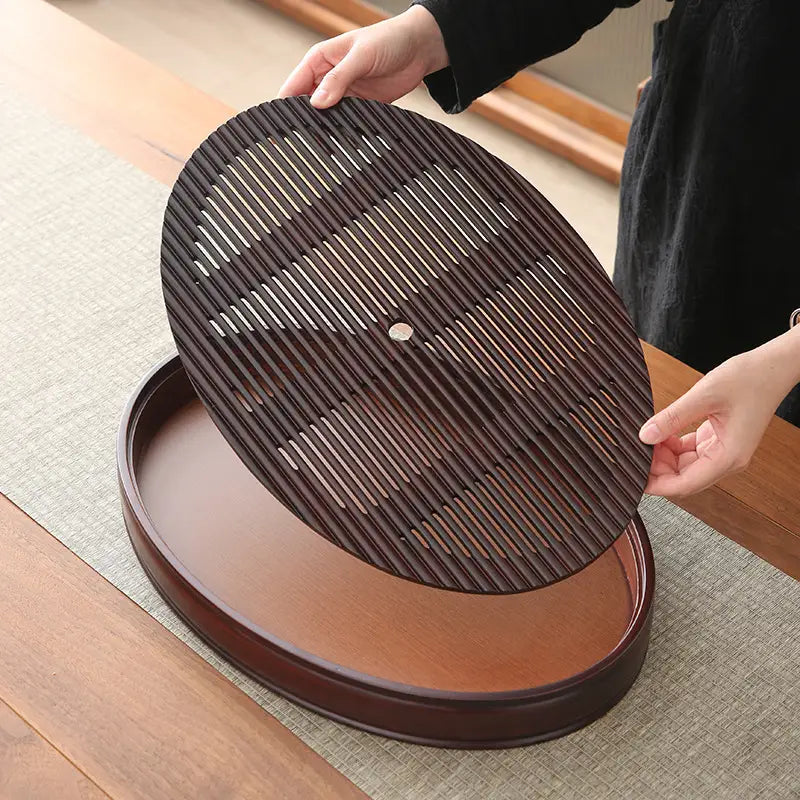 Oval bamboo tea tray with slotted lid from Flowing Zen for Gongfu tea serving