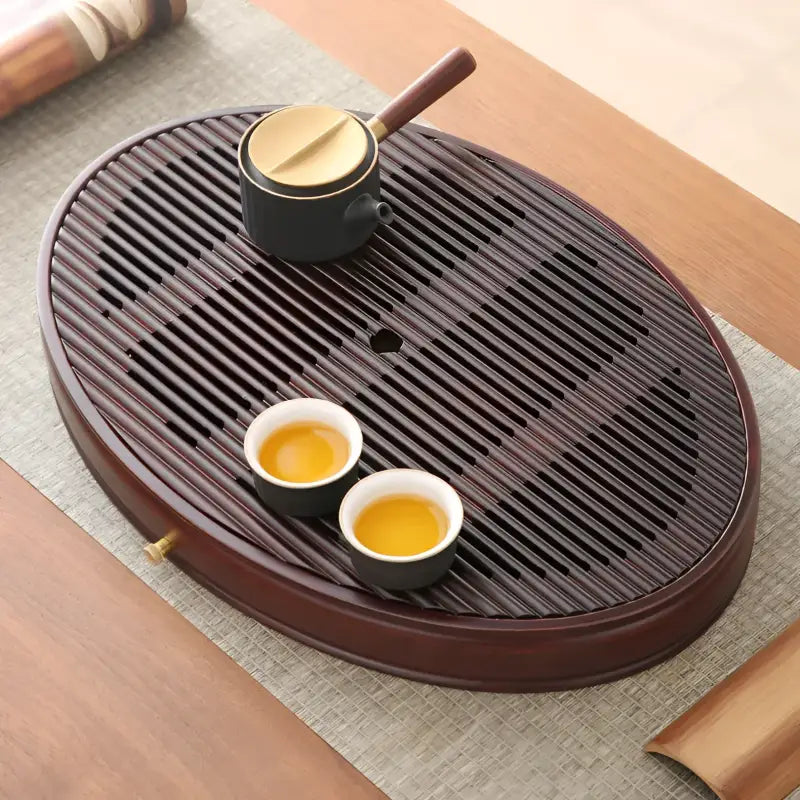 Oval wooden tea tray with tea set, flowing zen bamboo tea tray for Gongfu tea brewing