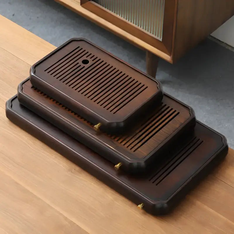 Stacked dark wooden tea trays from Flowkeeper Dual-Layer Bamboo Gongfu Tray for gongfu tea