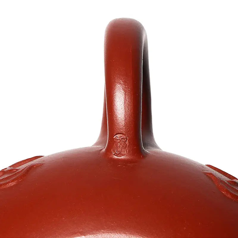 Red ceramic pot with handle from Imperial Ascend Yixing featuring a hand-carved dragon design