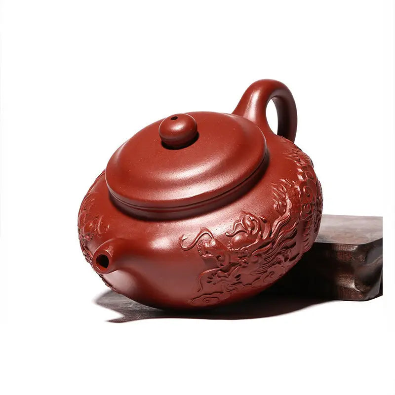 Reddish-brown Yixing Zisha teapot with hand-carved dragon relief from Imperial Ascend Yixing