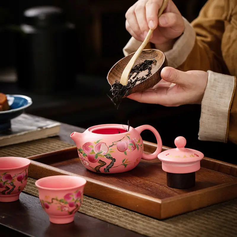 Peach-themed Forest Echo Tea Set made from Yixing Zisha clay featuring Zisha clay craftsmanship