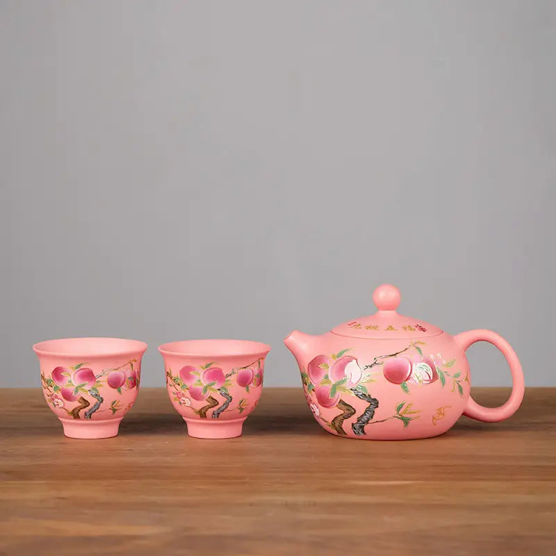 Peach-themed pink ceramic tea set from Forest Echo featuring Yixing Zisha Zisha Clay