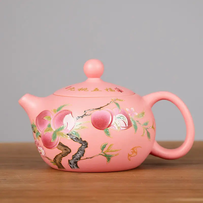 Peach-themed pink ceramic teapot from Forest Echo Yixing Zisha clay tea set