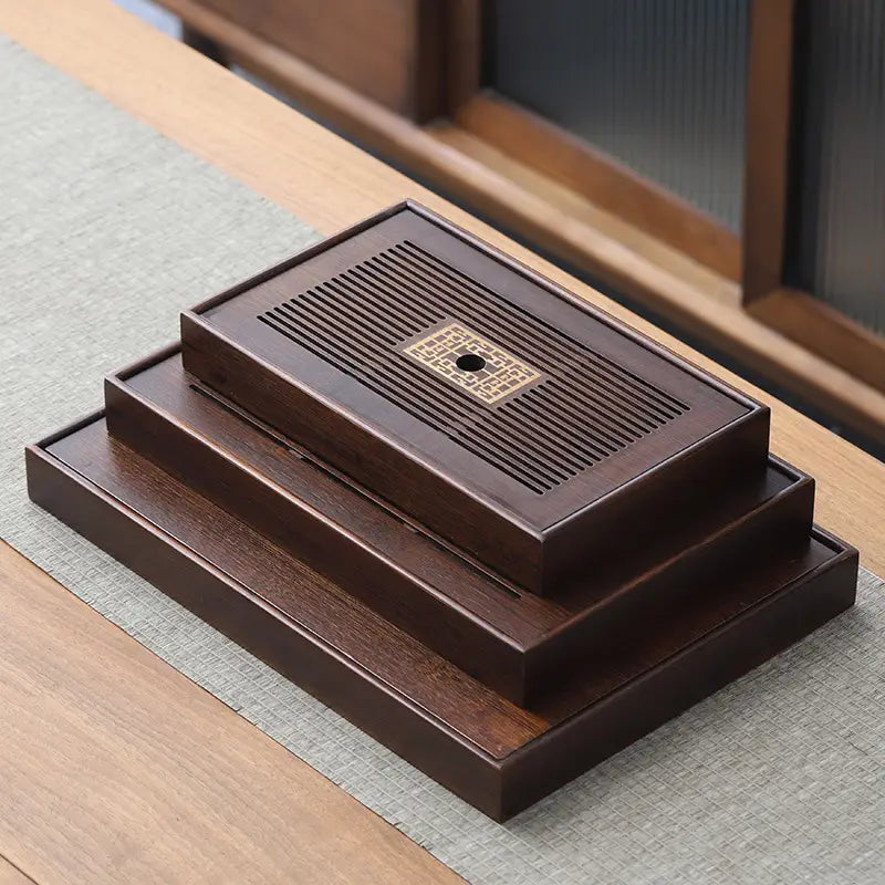 Stacked dark brown wooden tea tray for Gongfu tea brewing, bamboo tea tray design