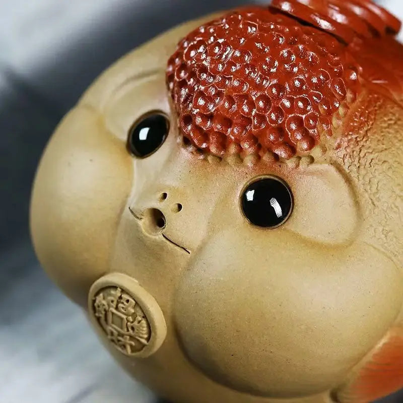 Ceramic Fortune Bloat fish tea pet with bulging cheeks and textured Yixing clay head