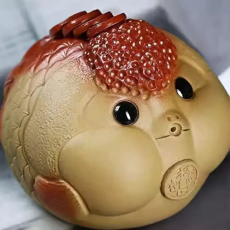 Round tan-colored fish tea pet figurine with red accents for Yixing clay feng shui tea pets