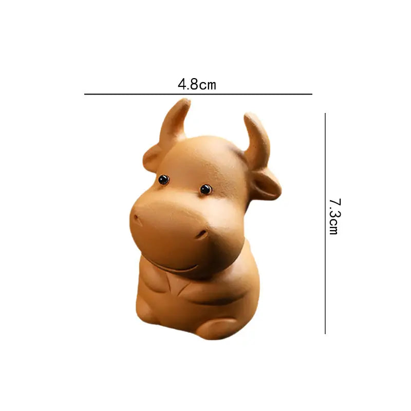 Brown cow figurine from Fortune Grazer tea pet guide showcasing dimensions for feng shui tips