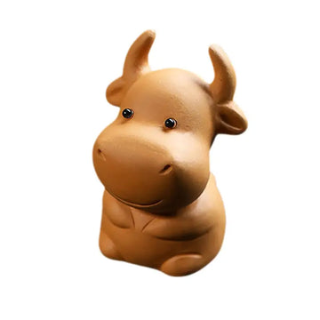 Brown ceramic cow figurine Fortune Grazer tea pet guide for good luck and feng shui tips