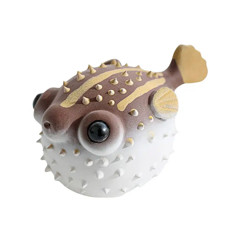 Brown and white pufferfish toy Fortune Puffer tea pet from the tea pets guide