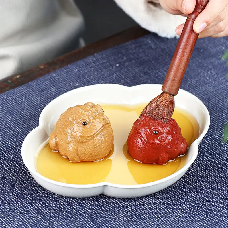 Two toad figurines in a dish, Fortune Warden Toad tea pet for Yixing Zisha tea ambiance