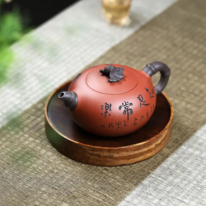 Red-brown Yixing Zisha teapot with frog lid sculpture and dark handle for Frog’s Wisdom