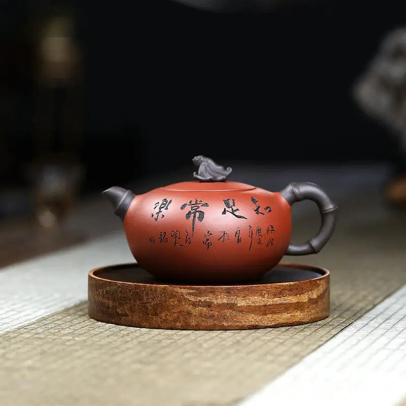 Reddish-brown Yixing Zisha teapot with frog lid sculpture and dark handle for Frog’s Wisdom