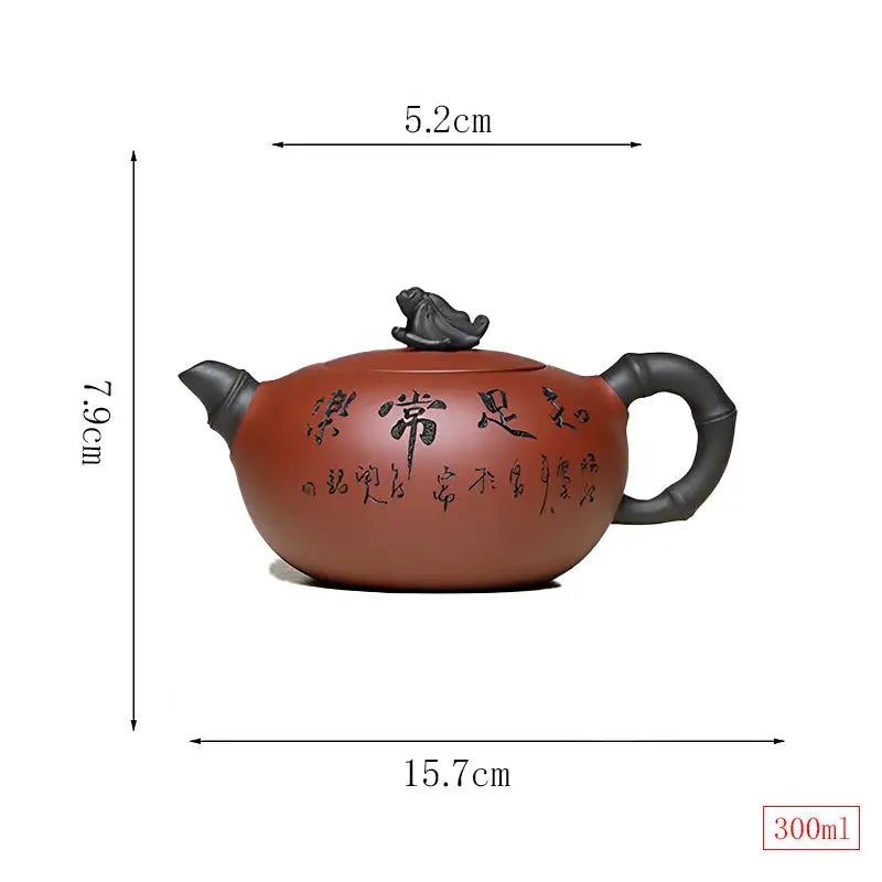 Brown ceramic yixing zisha teapot with frog lid sculpture and bamboo handle in Frog’s Wisdom