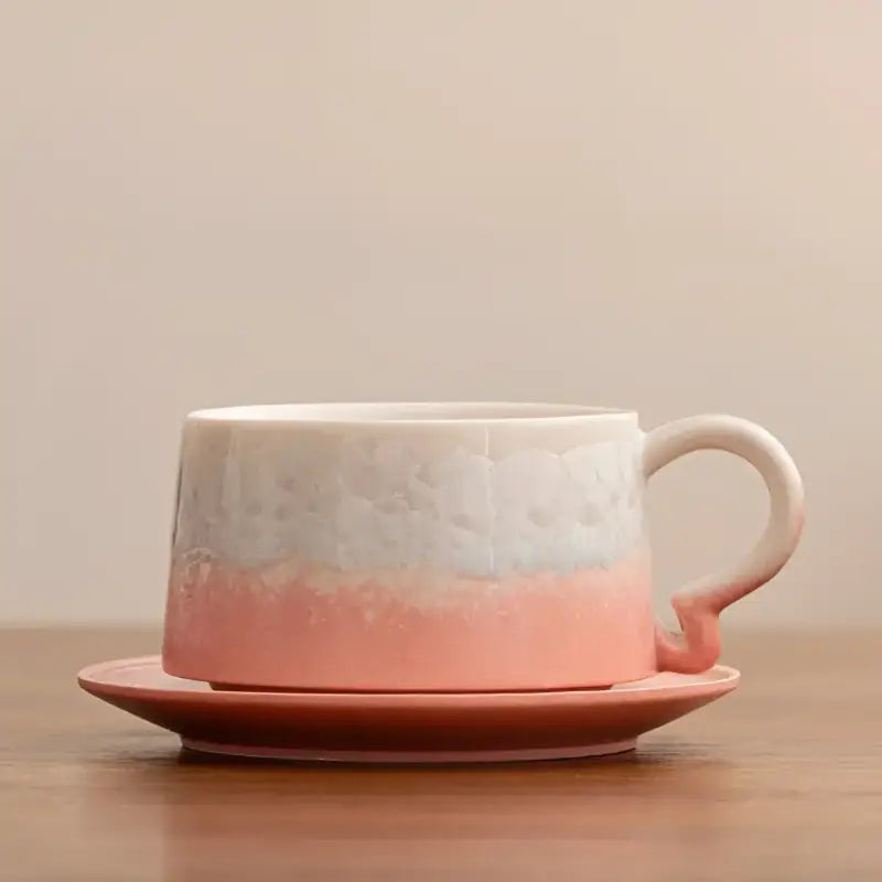 Two-toned ceramic coffee cup with tenmoku glaze and matching saucer for Frosted Dawn