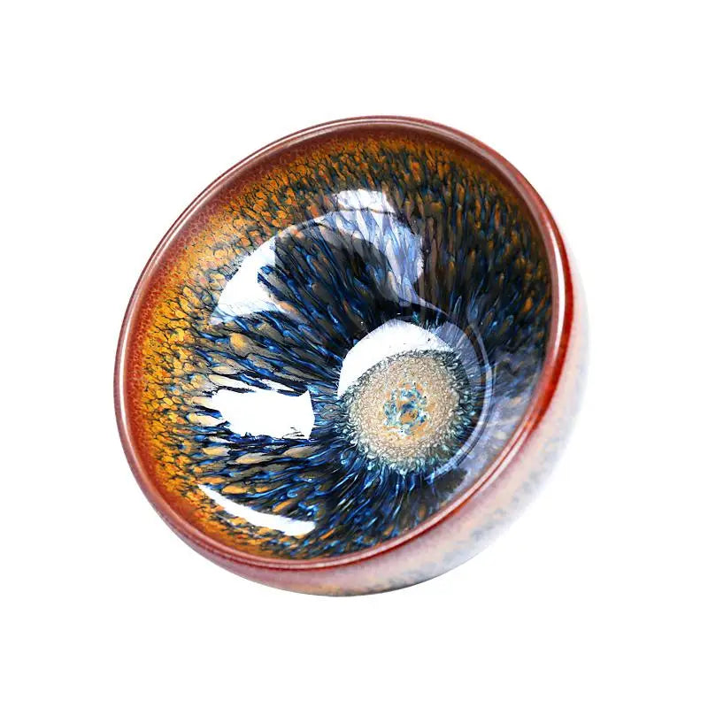Ceramic tea cup with iridescent glaze from Geocentric handcrafted Jianyang Tenmoku collection
