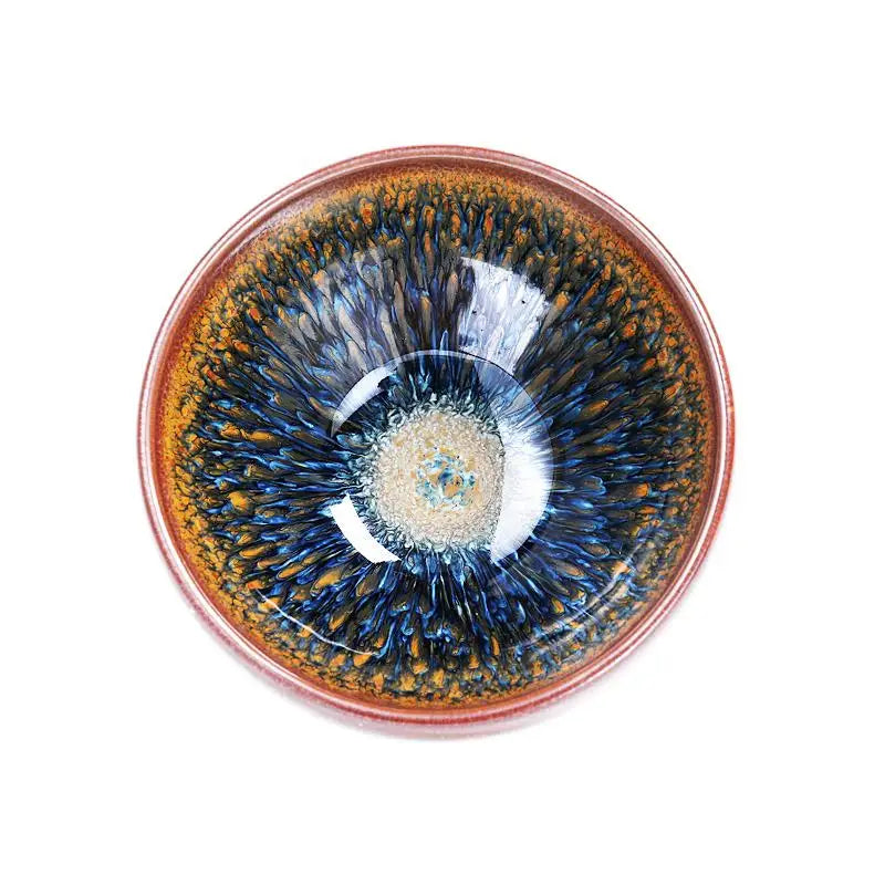 Ceramic bowl with blue and gold glaze from Geocentric handcrafted Jianyang Tenmoku tea cup