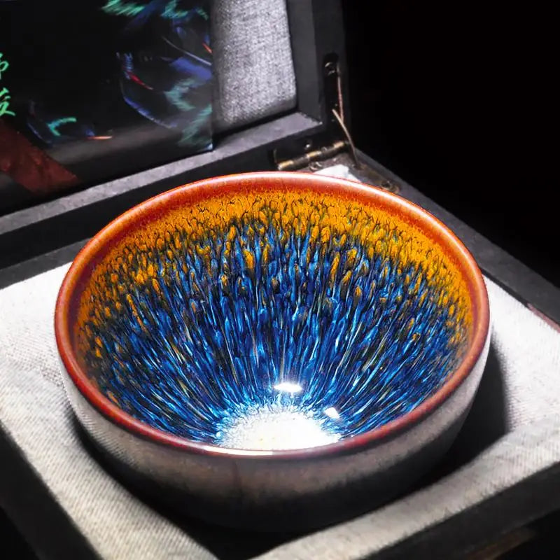 Ceramic bowl with blue and gold glaze from Geocentric, perfect for handcrafted Jianyang Tenmoku Gongfu tea cups