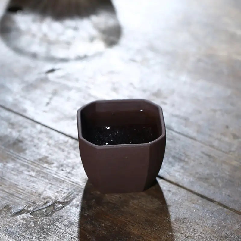 Octagonal brown Zisha clay teacup from Geometric Tranquility for Gongfu Tea brewing