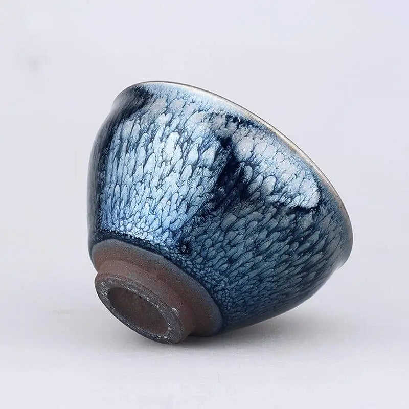 Blue and white glazed ceramic tea bowl from Glacier Jian Zhan collection