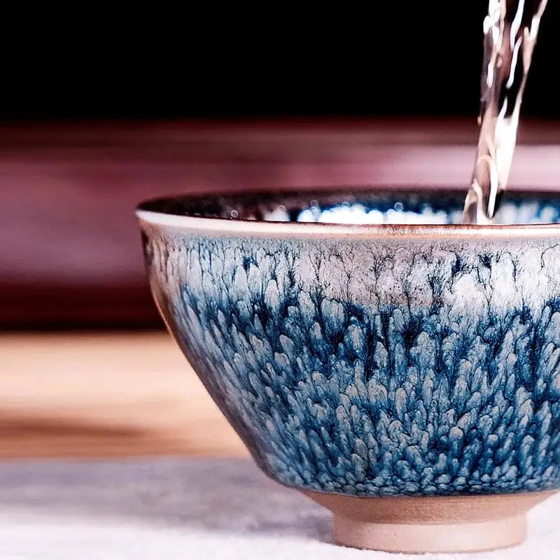 Blue and white speckled ceramic tea bowl from Glacier Jian Zhan Tenmoku Tea Bowl collection