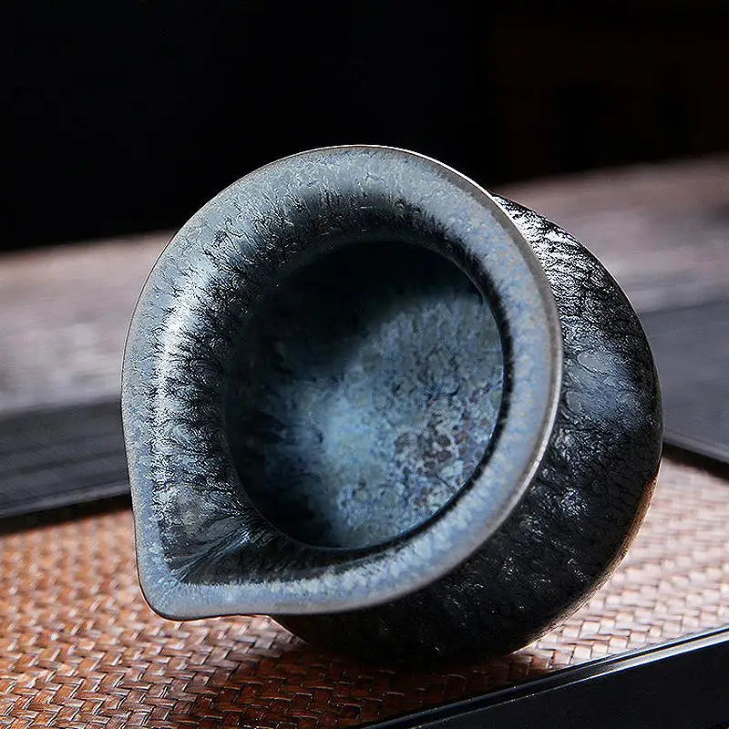 Dark textured ceramic pitcher from Glacier Tea Set with crystalline and Tenmoku glaze