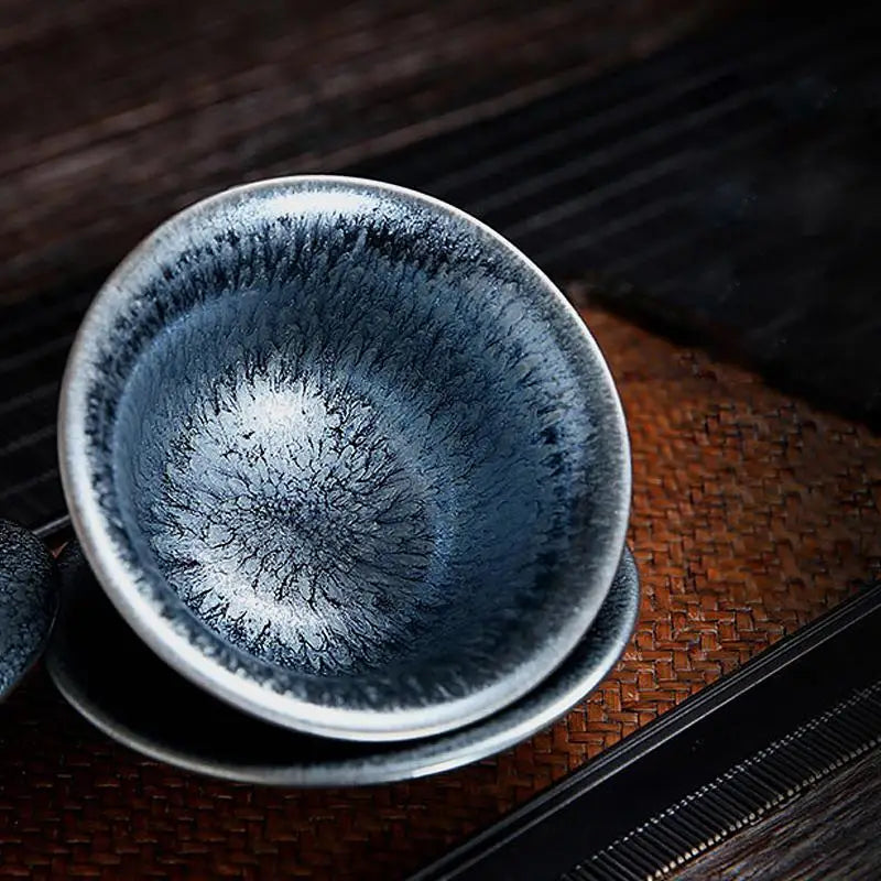 Blue and white glazed teacup from Glacier Tea Set featuring crystalline glaze and tenmoku glaze