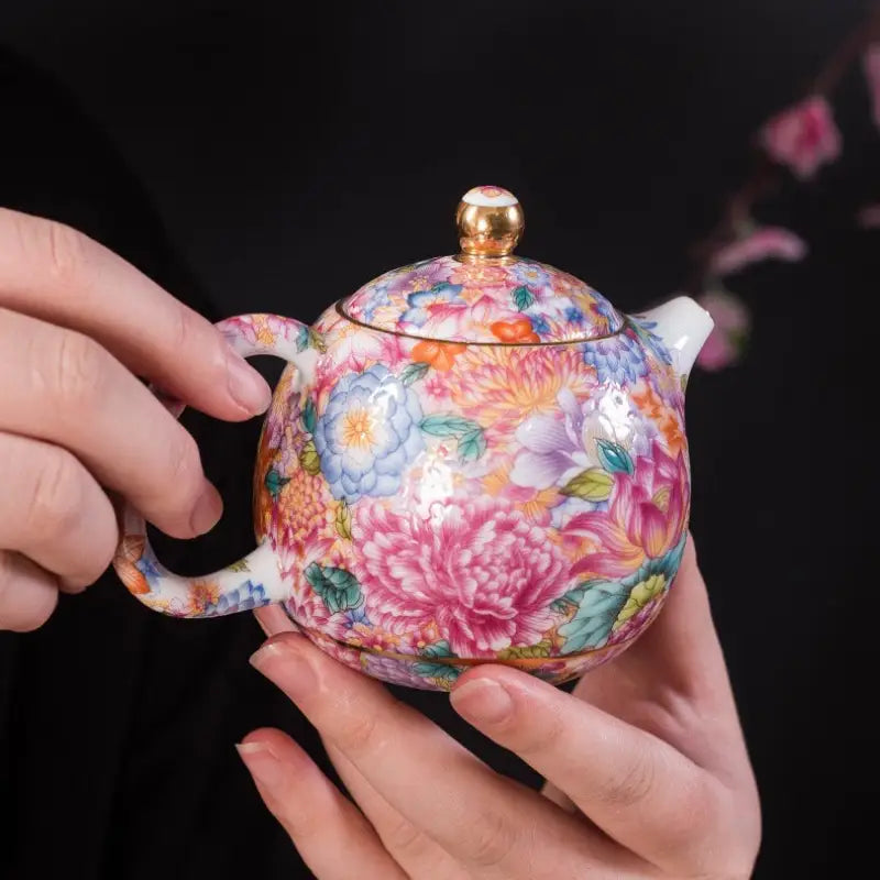 Gold floral enamel teapot with floral-patterned ceramic design, showcasing Jingdezhen enamel art