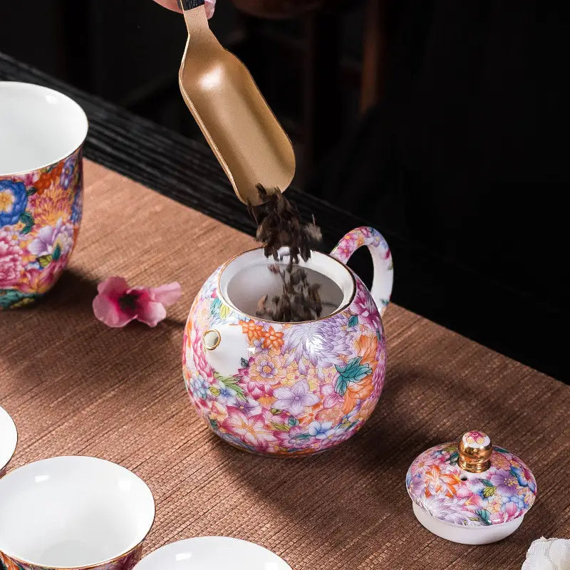 Gold floral enamel teapot with floral-patterned design showcasing Jingdezhen enamel art