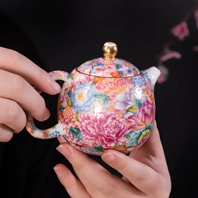 Gold floral enamel teapot with floral-patterned ceramic design, showcasing Jingdezhen enamel art