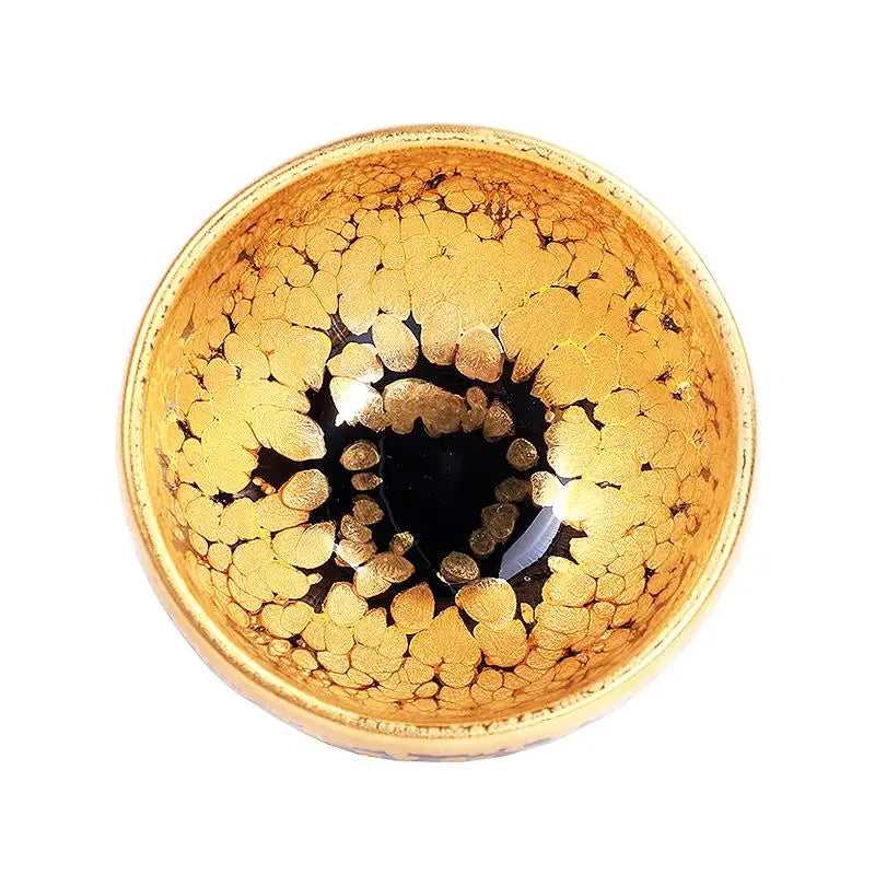 Radiant golden Gold decorative bowl with black accents, perfect for Gongfu tea and Jian Zhan teacup display