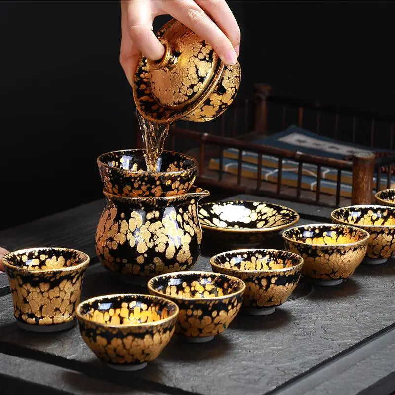 Black and gold tea set including a fairness pitcher for Jian Zhan tea brewing