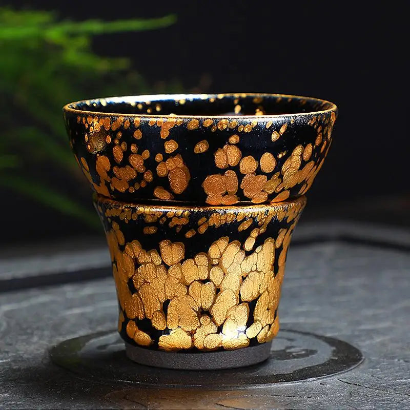 Black and gold ceramic cup from Gold Tea Set, perfect for Jian Zhan Tea or fairness pitcher